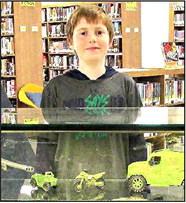 Displayer for the month of September 2023 at Rhoads Memorial Library is Liam Cosden, 11 years old who is exhibiting replicas of various types of military vehicles.