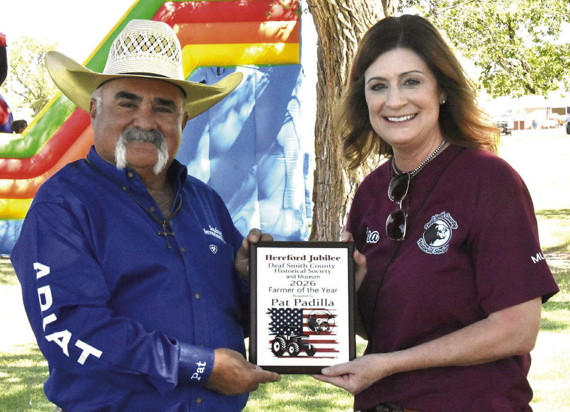 TOP FARMER/RANCHER--Pat Padilla accepts the Farmer/