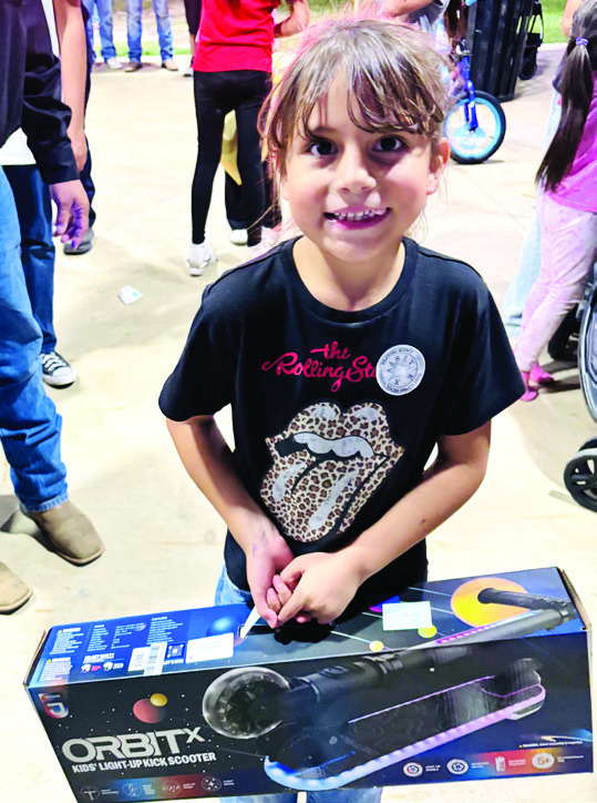Winners of prizes at National Night Out in Dameron Park October 6 included (above) Kindergarten Winner Mariah Flores.
