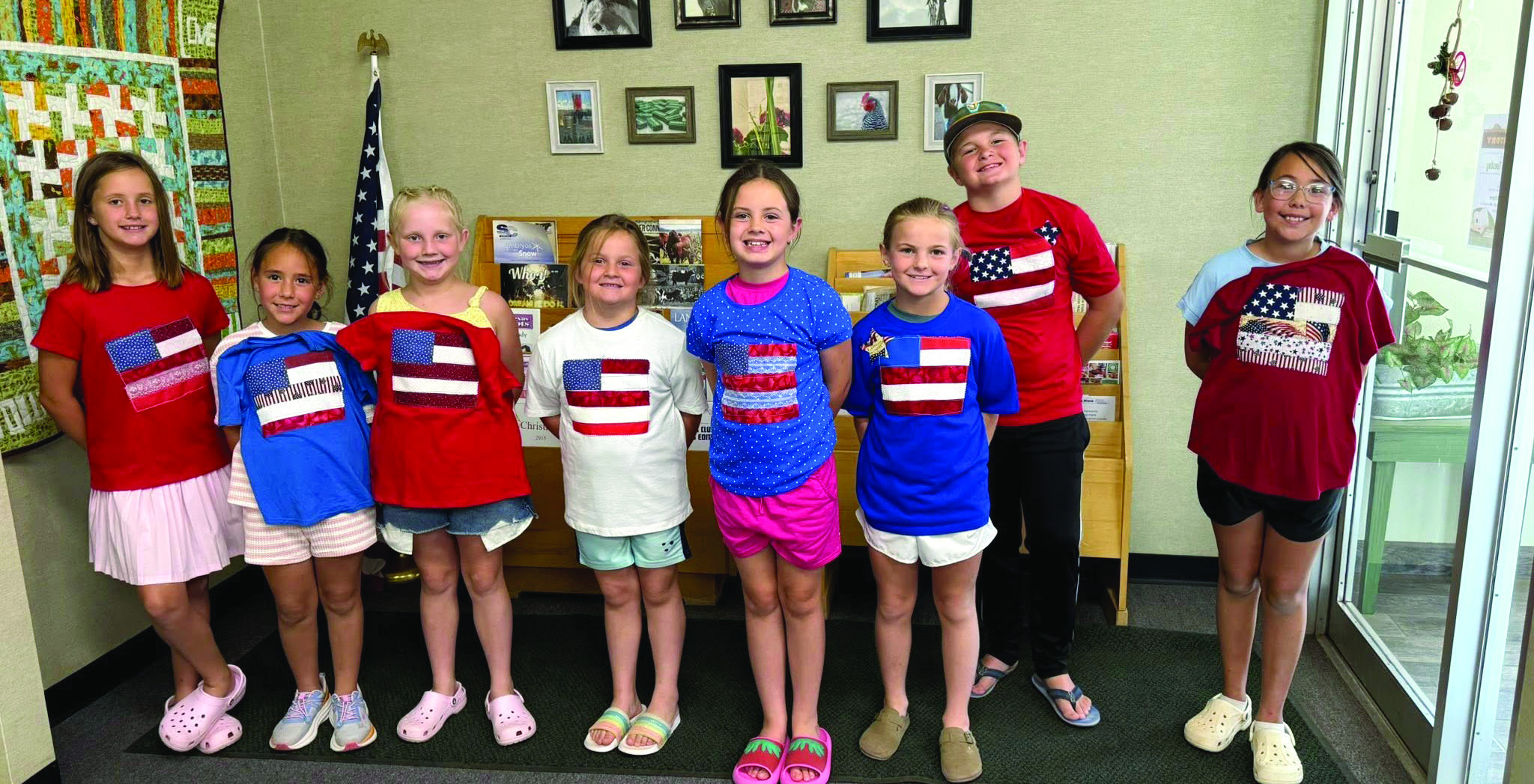 To get ready for the nation's 250th birthday, Castro Coun - ty 4-H made American Flag T-shirts and coasters June 14. The group learned about using fusible to make our flag, sewing on a T-shirt and using a sewing machine to not stitch both sides, strip piecing to make a coaster and us - ing fusible to add stars. (Courtesy photos)