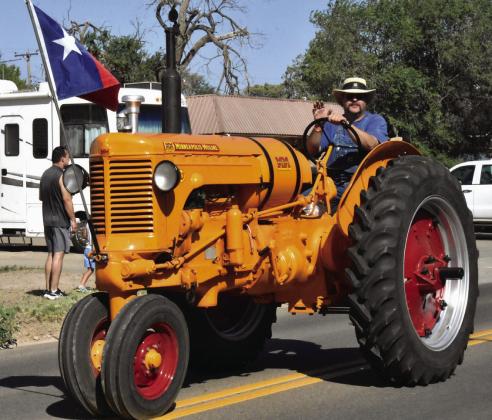 BEST IN SHOW--Ryan Wieck with his Best in Show tractor, a 1950 Minneapolis Moline. (Photo by Jim Steiert)