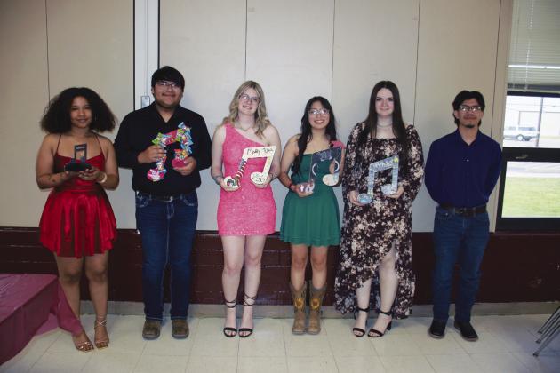 Senior Band members with their musical notes: Jerriah Brookins, Isaiah Hernandez, Maddy Klein, Scarlett Chavez, Avary Wesley, and Vahn Guerrero