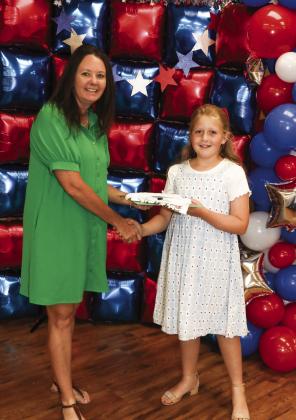 Christina Flowers presented Charlie Price with a Project pin
