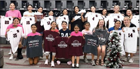 Before facing Bushland and Tascosa in a Friday scrimmage, the Lady Whitefaces received their jerseys and paused for a picture with new ball girls for the volleyball team. Tuesday the Lady Herd take on Palo Duro on the road in the season opener. (Courtesy photo)