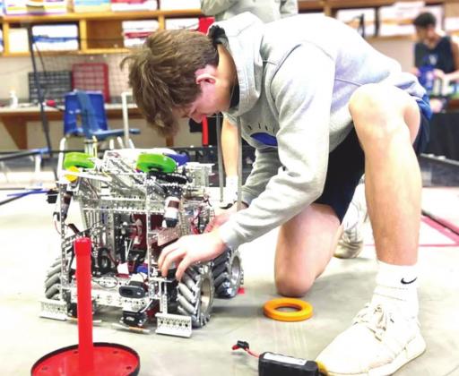 Luke Schulte of Team 16617m Nazareth Robotics, prepares a robot for competition. Photo by Chloe Birkenfeld.
