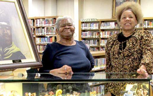 Gwen Lewis, left, and Joyce Thomas are providing the Display of the Month for February at Rhoads Memorial Library. They are exhibiting items pertaining to Black History Month.