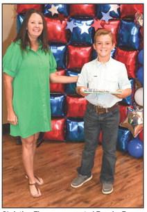 Christina Flowers presented Brooks Brown with a Project pin