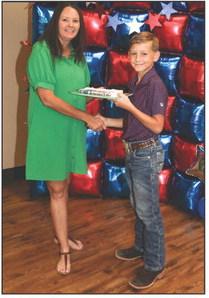 Christina Flowers presented Witten Butler with a Project pin