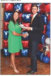 Christina Flowers presented Kannon Flowers with a Project pin