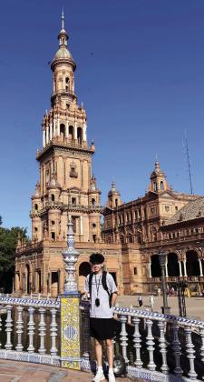 AMBASSADOR CALLS AT PALACE-- Deaf Smith County 4-Her Max Hedrick poses before the Royal Palace in Spain during his recent stint there as a 4-H Ambassador.