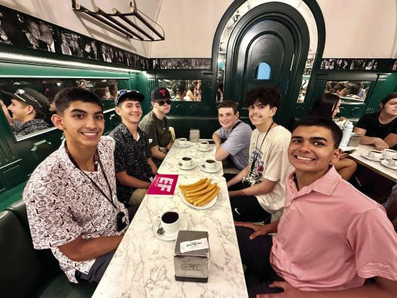 CHURROS CON CHOCOLATE--While Texas 4-Hers including Max Hedrick may have already known their home state version of churros, they enjoyed the culinary treat dipped in chocolate while visiting Spain.