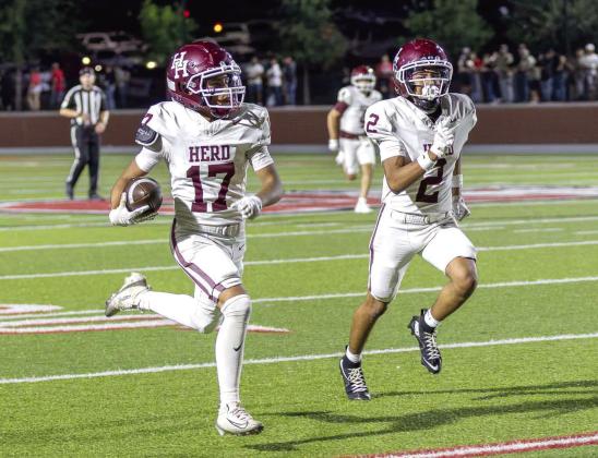 Noel Castillo (17) and Lucio Sifuentes (2) race toward the end zone during the Herd’s win against Borger Friday night. It was the first Hereford win for new Hereford Head Football Coach Matt Medley. (Courtesy photo)