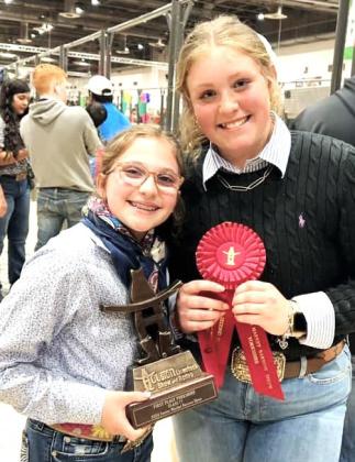 Nazareth FFA Chesney Farris and Autumn Birkenfeld won first and second in the Yorkshire HW barrow class (77) at the Houston Livestock Show.