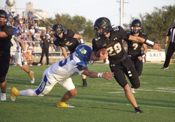 Sprinting towards the end zone, Gabriel Mosser (#29) attempts to slide past Rhett Ethridge (#5) as he dives for the tackle. Mosser scored Happy’s only touchdown as the Cowboys lost to the Nazareth Swifts 6-52. Photo by yearbook staff member Eva Burris