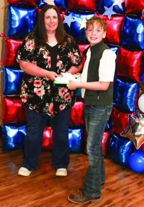 Tori Dunn presented Grayson Nolen with a Project pin