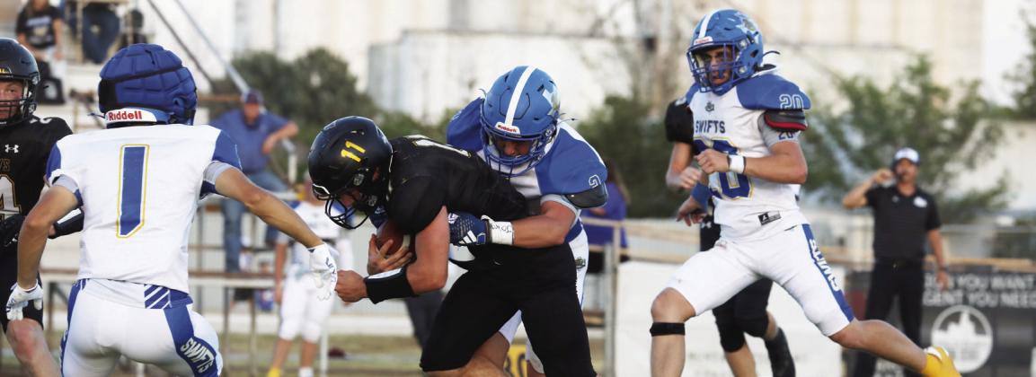 The Nazareth Swifts (above, against Happy in week one) lost to Borden County Friday 50-0. Pictured above are Rhett Ethridge (5), Copper Farris (2), Cole Braker (20) and Lin - coln Pohlmeier (1).