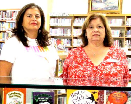 Displayers of the Month are Rhoads Memorial Library staff Patty Padilla and SullemaOltivero with a spooktacular exhibit and skeleton reading for young ghosts.