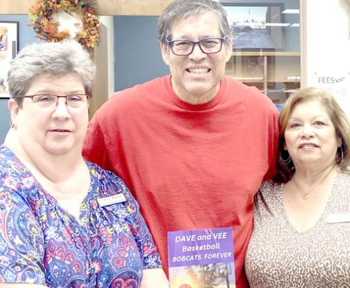 David Espinoza with Library personnel Gaye Reily and Sulema Oltivero.