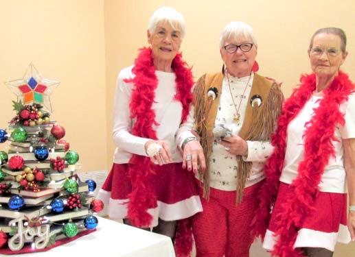 (left to right) Laurel (Ivey) Austin of Abernathy, Mary Ruth Baird, and Zetha Collins provided the Christmas program for Dimmitt Book Club in the meeting room of Rhoads Memorial Library.