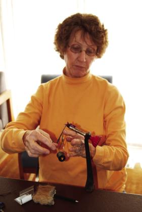 TYING A TROUT GETTER-In happy times of yesteryear 4-H adventure, Judith Jones came to Hereford to share her fly tying skills and know-how with lucky members of the Trailblazers 4-H Club. Her generosity made an impression. (Photo by Jim Steiert)