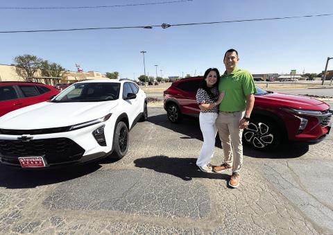 Isaac and Rita Walker of Stevens 5-Star Car &amp; Truck Center stand in front of two new 2026 Chevrolet Trax, the same model of car which will be given away to one Hereford High School senior Friday night during Hereford High School graduation.