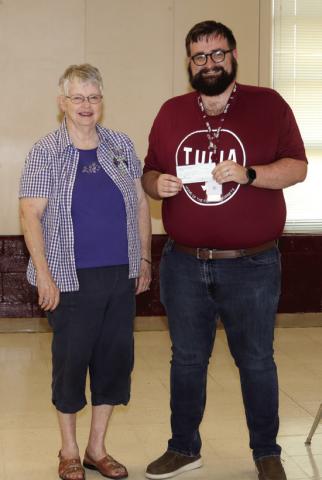 SBRSP member Sheila Via presented Tulia High School teacher Zachary Wilhite with a Classroom Incentive check
