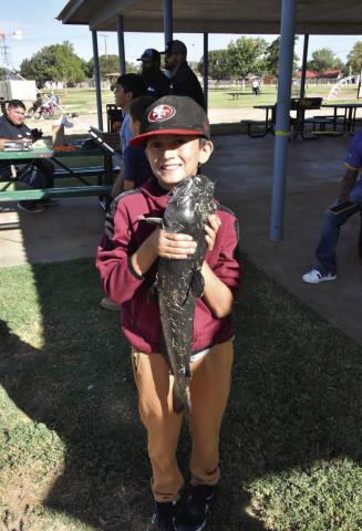 NOW THAT’S A CATFISH!—Zayden Tijerina, 10, caught this 26-3/8-inch catfish that took big fish honors at the September 19 Texas Junior Anglers event. (Photo by Jim Steiert)