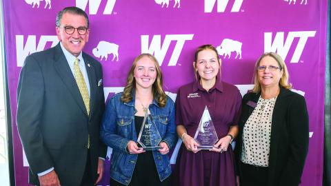 West Texas A&amp;M University President Walter V. Wendler, left, and Pamp Young, right, assistant vice president for human resources, celebrate the WT student employees of the year: Landry Posey, second from left, undergraduate student employee of the year, and Jessica Kenedy, second from right, graduate assistant of the year.