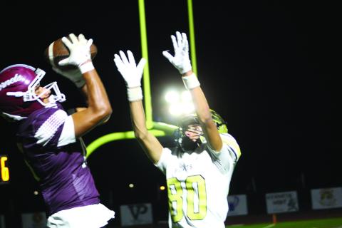 Adrian Reyes makes the catch in the end zone to score