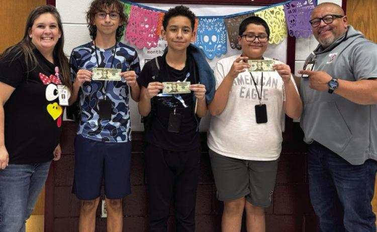 Winners of the Perfect Attendance Drawing for students who had perfect attendance for the six weeks were 8th grader Tucker Boudinot, 7th grader Brayan Mendoza, and 6th grader Efrain Rosales! Pictured with the attendance winners are Attendance Clerk Jamie Klein and Assistant Principal Robert