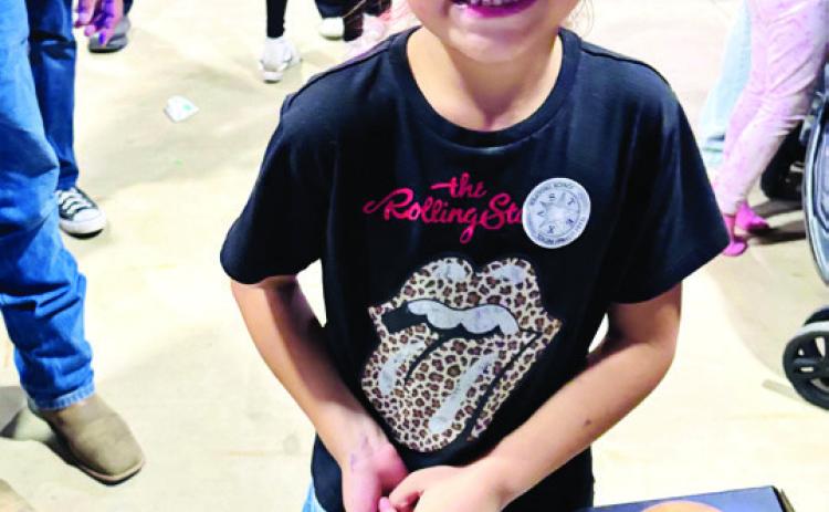 Winners of prizes at National Night Out in Dameron Park October 6 included (above) Kindergarten Winner Mariah Flores.