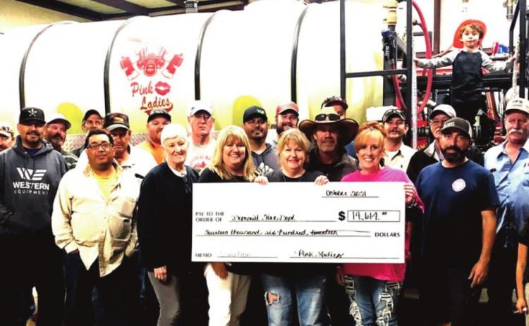 The Dimmitt Pink Ladies presented a check for $14,614 to the Dimmitt VFD following another successful chili cookooff benefit and DVFD golf tourney.