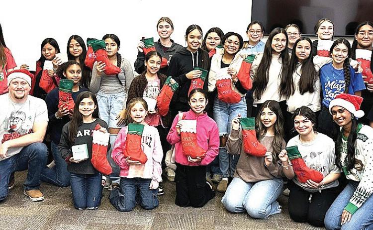 This past Sunday, the Texas Tech pediatric doctors met with Hart High School students to discuss the value of staying in school and not giving up hope. Students got to stuff a stocking to take home, and create gift baskets for some elderly residents of Hart and delivered them.