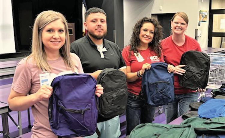 DISD School Supply Drive - Laura Case-CCH CFO, Gabriel Montiel, In a Jam Organization, Angelica Montiel, CCH Pharmacy, and Elisha Rosier-CCH CEO.