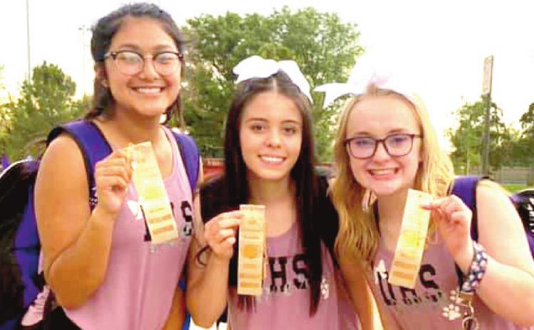 DHS cheerleaders Nina Vasquez, Karla Perez and Klancy Bruton