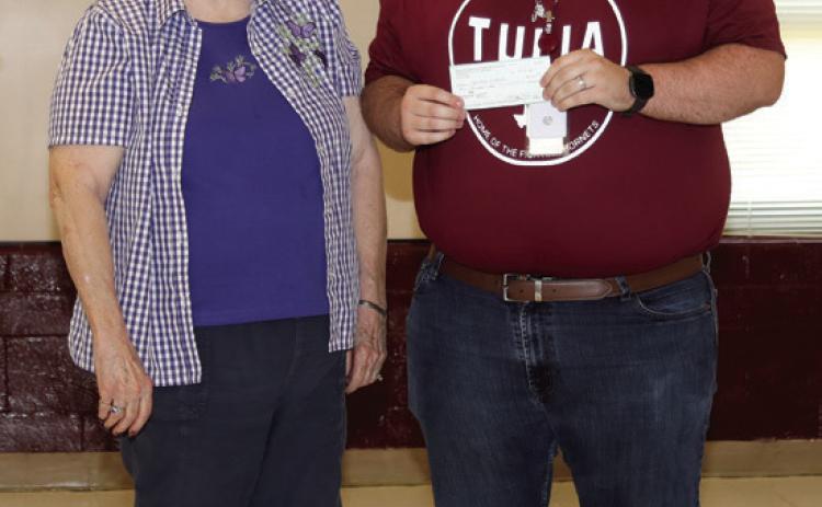 SBRSP member Sheila Via presented Tulia High School teacher Zachary Wilhite with a Classroom Incentive check