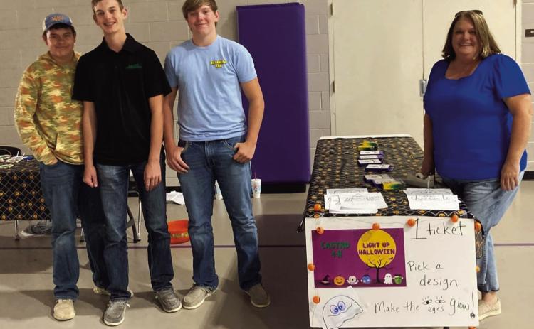 This past Saturday night at DHS, Castro 4-H had a booth at the Dimmitt Fall Carnival. Texas 4-H STEM Ambassador Spencer Acker planned the booth where youth colored Halloween faces and then used copper tape, to create a circuit that makes eyes light up. 4-Hers Harrison Meador, Caysen High, Oliver Meador and Remington Meador manned the booth and helped youth all night with their creations.