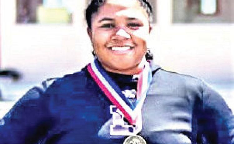 Following up a successful state powerlifting meet, DHS Varsity Na’Khiyah Porras won the District shot put division and qualified for the Area meet. See all the District results in the Sports Zone.