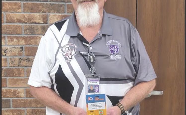 Don Bell was recognized at the district meet with the Compass Award, naming him District Coach of the Year