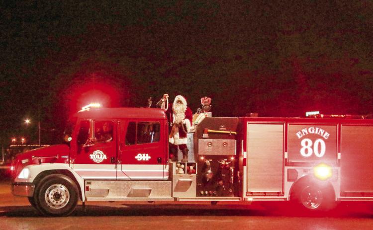 Santa and the Grinch visit Tulia Fire Department