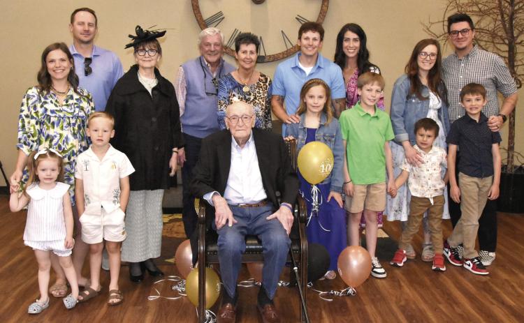 CENTENNIAL CELEBRATION--William Eugene “Bub” Sparks, seated center, marked his 100th birthday on Monday, May 4. A reception was held in his honor Sunday, May 3 in the Fellowship Hall of First Baptist Church with a huge crowd of family and friends in attendance. Here, Bub is shown gathered with members of the Sparks clan for a family photo to commemorate the occasion. (Photo by Jim Steiert)
