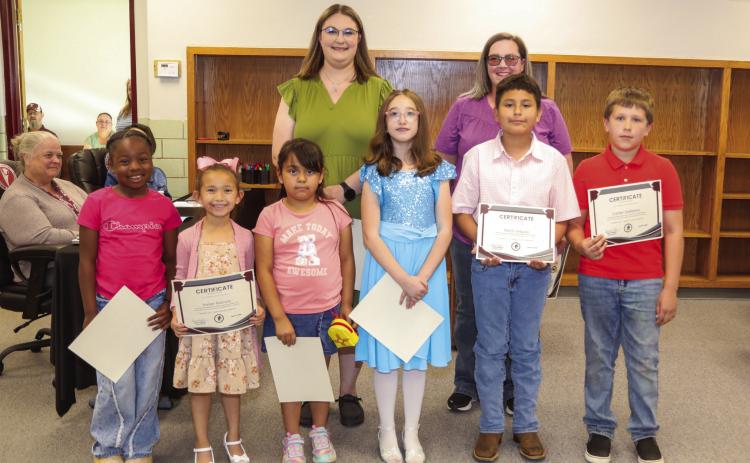 Tulia Elementary School Recognitions Back Row: Mikayla Adams, and Lori DeFries Front Row: London Session, Harper Pastrana, Alexa Bustos, Isadora Gatlin, Martin Delgado,