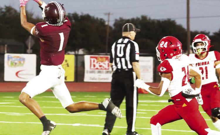 Tulia’s Logan Becerra catches the ball and runs it in for a touchdown
