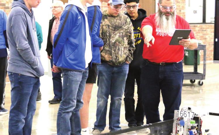 Naz Robotics team members Tanner Birkenfeld, Tagan Ramsey and Luke Schulte for team 16617, and Harrison Meador and Adrian Rios, team 18570 competed at the third West and Panhandle North League Meet. (photo by Chloe Birkenfeld)