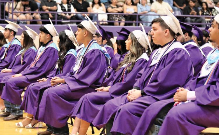 Dimmitt High School seniors, parents, family and friends attended the commencement ceremony for seniors who closed the door on high school to take a big step into the future (top photo). Many will be attending college, trade schools, joining the military or getting jobs as they continue their journey into adulthood. The DHS valedictorian was Veera Bhakta (bottom left) and the salutatorian was Isaura Guido (bottom right).