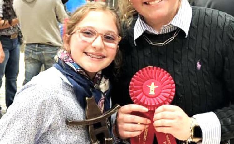 Nazareth FFA Chesney Farris and Autumn Birkenfeld won first and second in the Yorkshire HW barrow class (77) at the Houston Livestock Show.