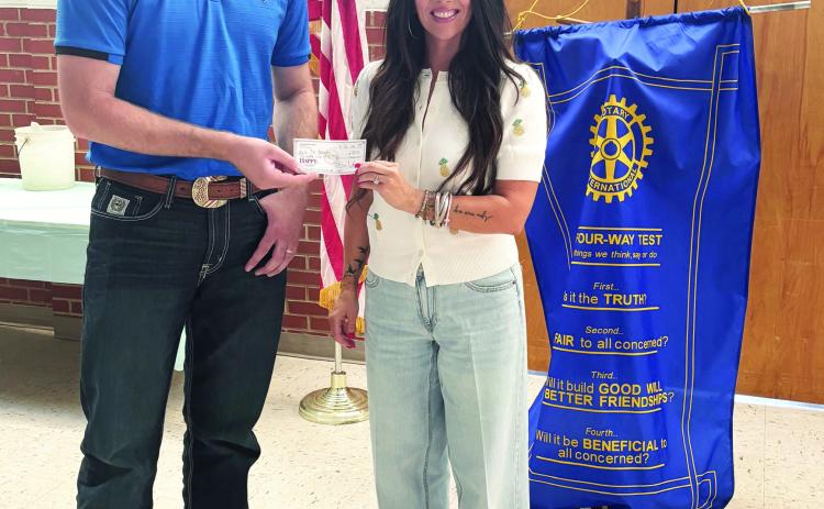Tulia Rotary Club recently made a donation to the Outcome. Sterling White presented the donation to Nichole Schmalzried at the Rotary Club meeting.