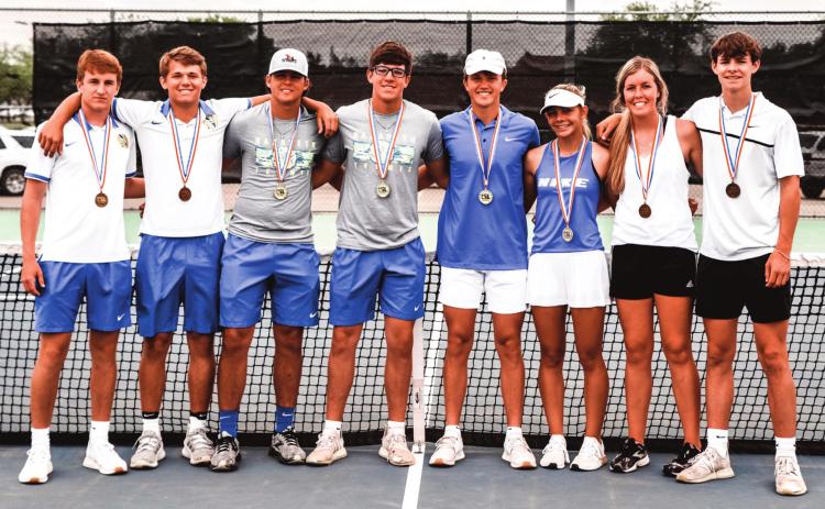 (Photo right) Nazareth Tennis Team members at Regional Meet – Chance Hochstein (Sr), Tye Schulte (Sr), Luke Betzen (Sr), Trent Gerber (Jr), Carson Heiman (So), Harley Gerber (Fr), Iris Schilerink (So) and Luke Schulte (So). (photo by Cynthia Huseman)