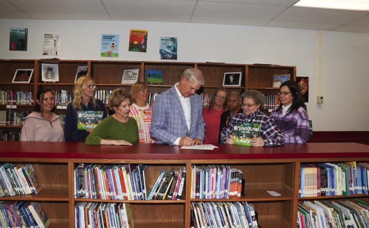 Judge Clawson signed the Child Abuse Prevention Proclamation recognizing April as Child Abuse Prevention Month in Swisher County. Pictured are Lillian Araiza, Sharon Wyatt, Joyce Childers, Nancy House, Judge Michael Clawson, Lisa Hooper, Yvonne Fifer, Lynnett Walker, and Dr. Tori Marnell.