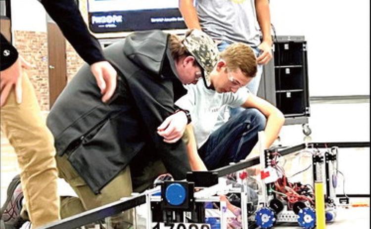 Nazareth Robotics team members Michael Fulkerson and Spencer Acker prepare for competition at the Amarillo scrimmage this past weekend offering the rookies a good opportunity to prepare for the upcoming season.